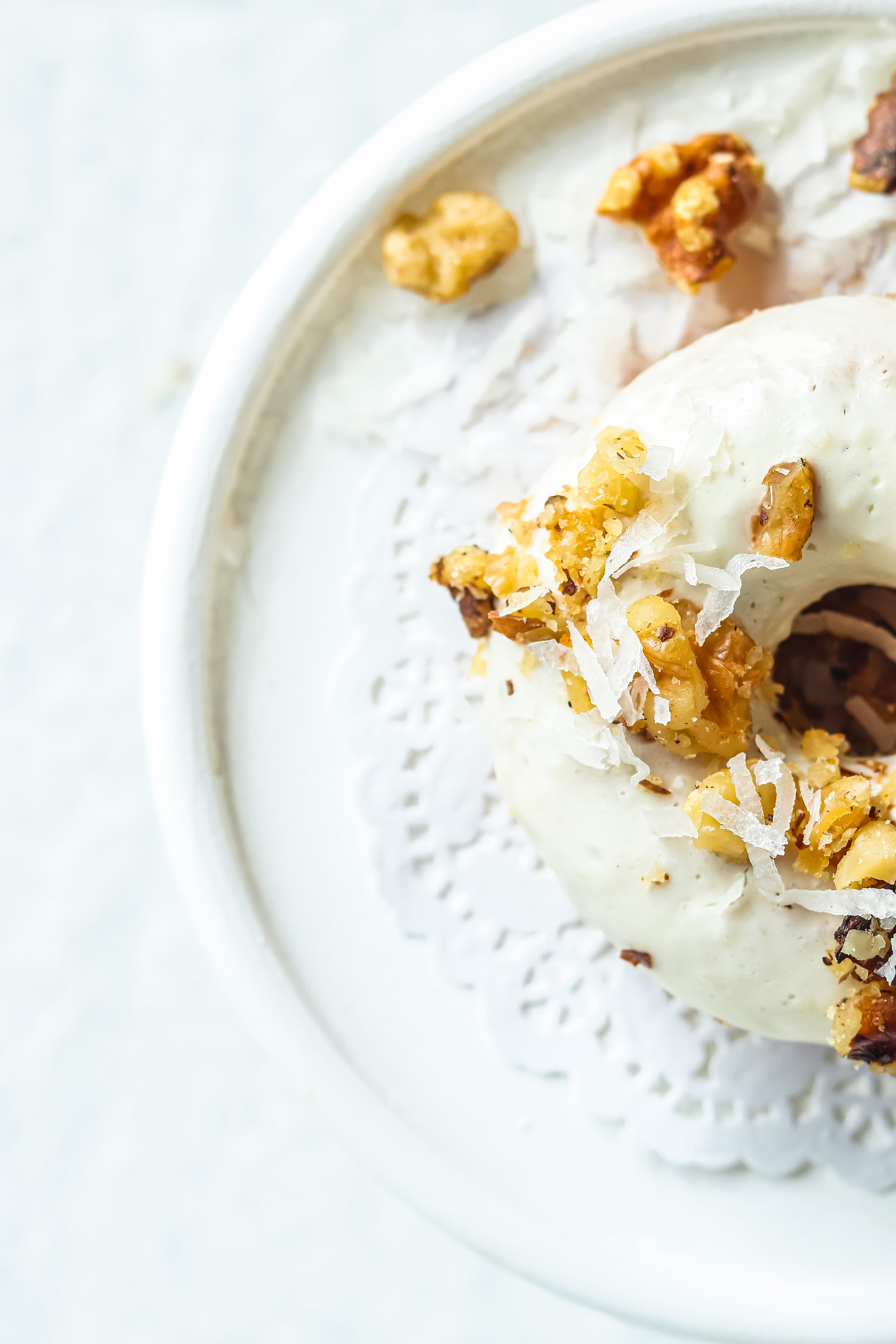 Light multi-layered croissant strewn with coconut and nuts